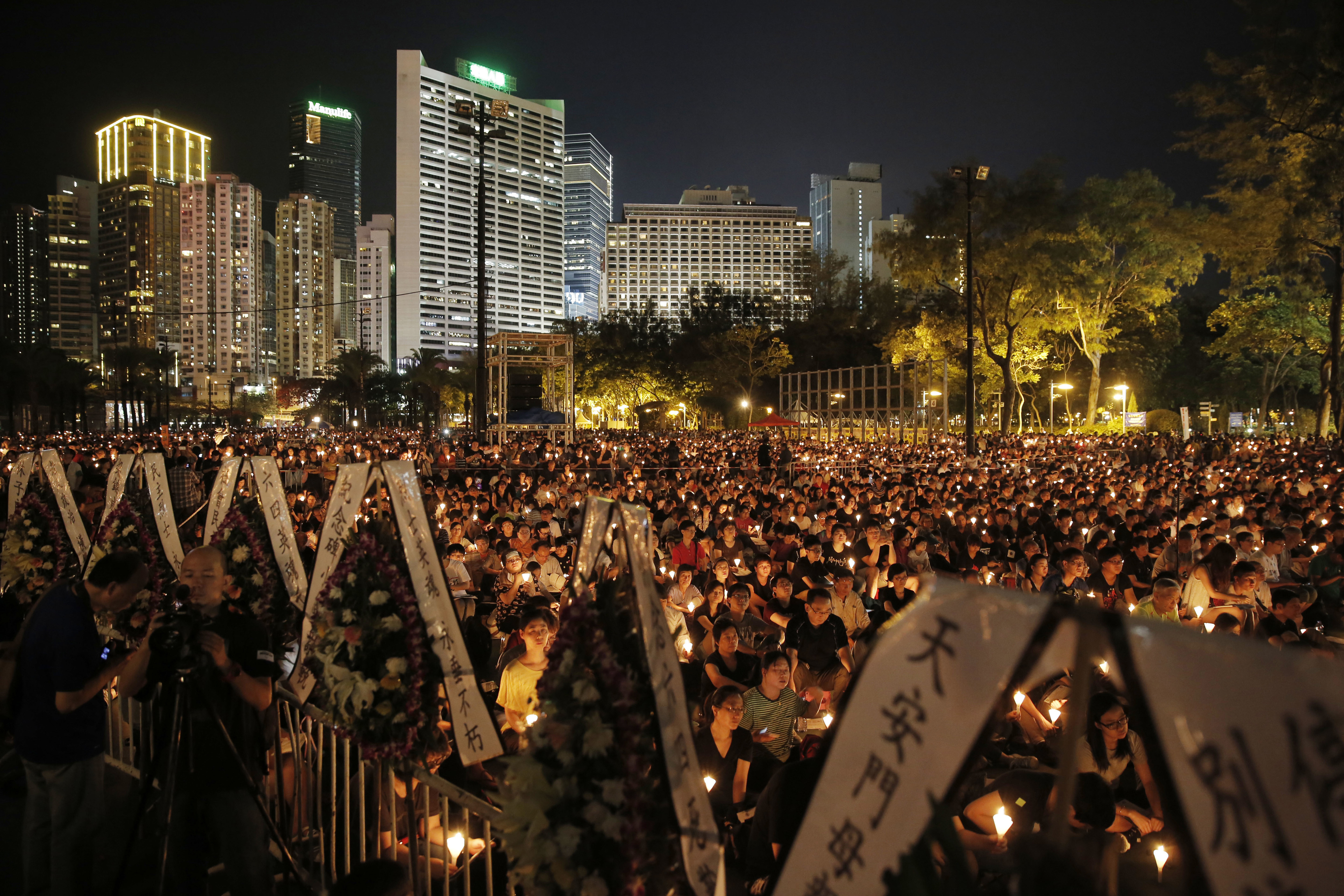 Tens of thousands of people attend a candlelight vigil at Victoria 