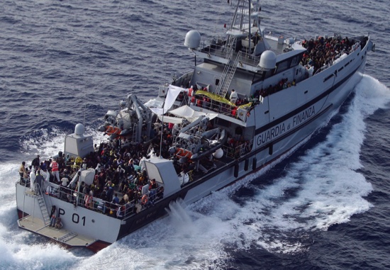 Rescued migrants are seen aboard MP01 ship of the Italian border police in the Mediterranean Sea